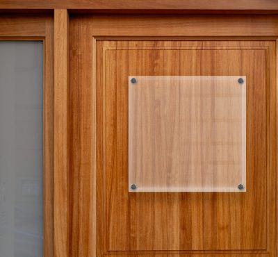 White square panel on wooden door