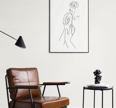 Picture frame with line art by a reading coffee table in a living room